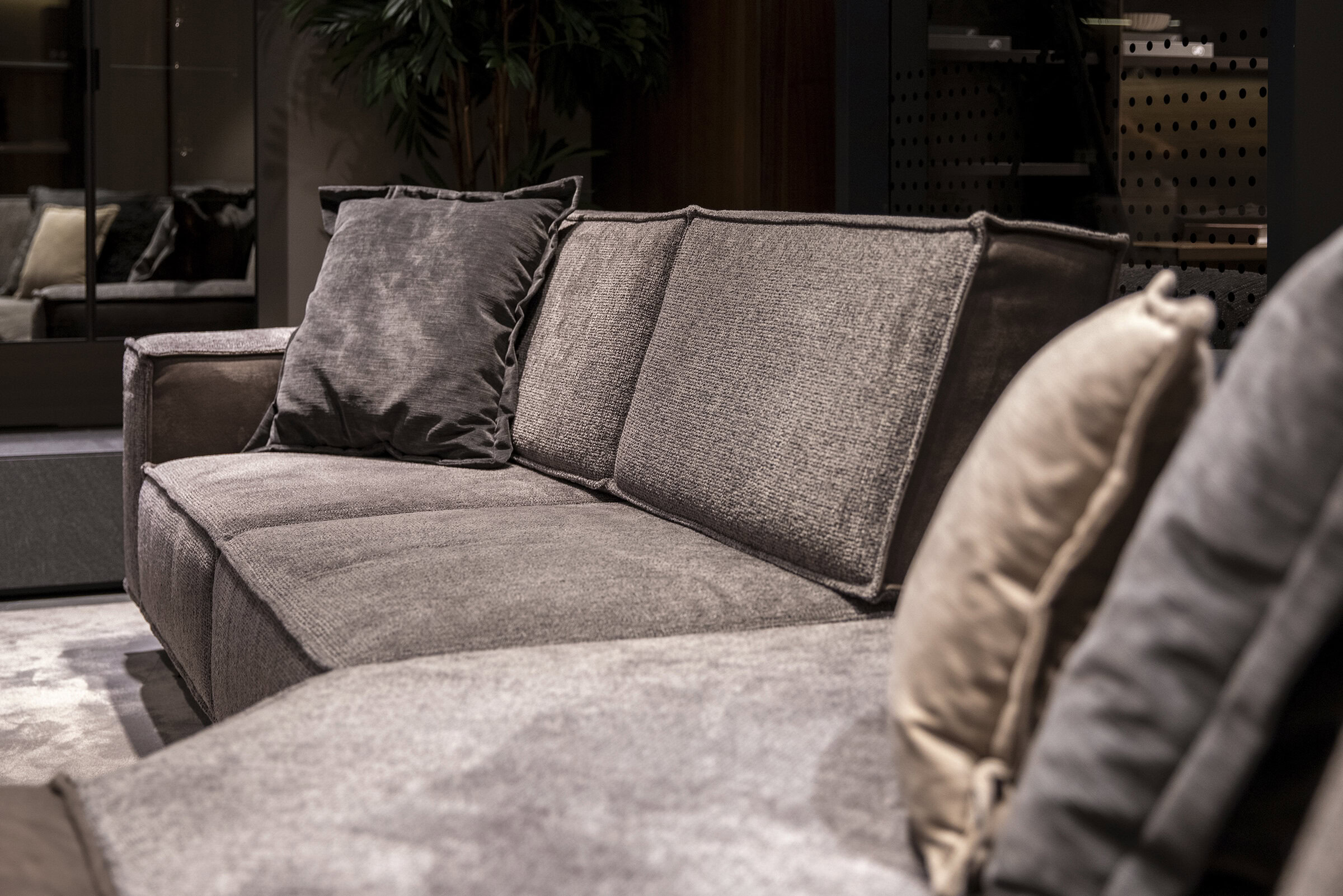 Comfortable modern gray fabric sofa with plush cushions and stylish design, ideal for contemporary living room decor and adding elegance to your home furniture collection.