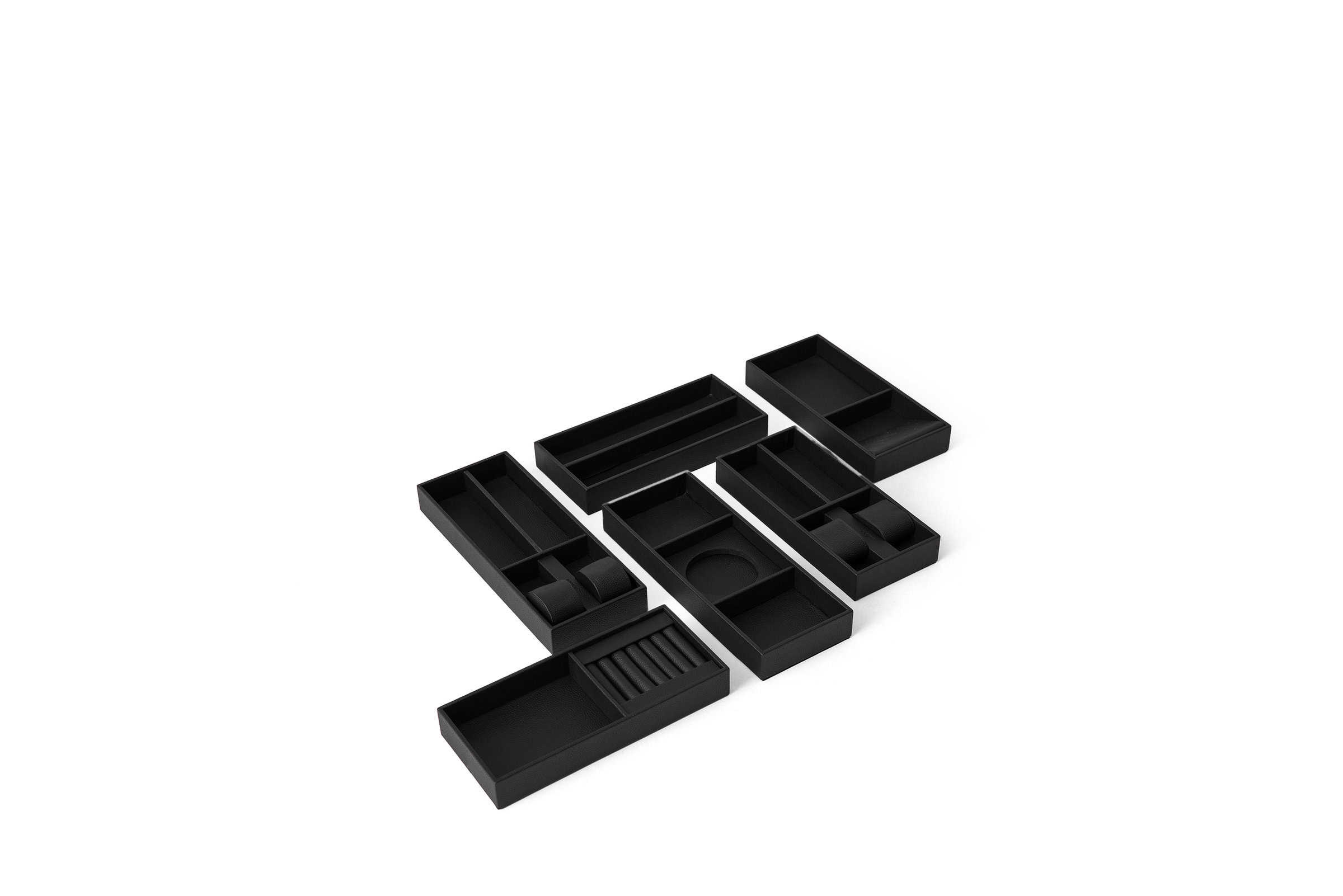 Black drawer organizers with multiple compartments for kitchen, office, or craft storage solutions.