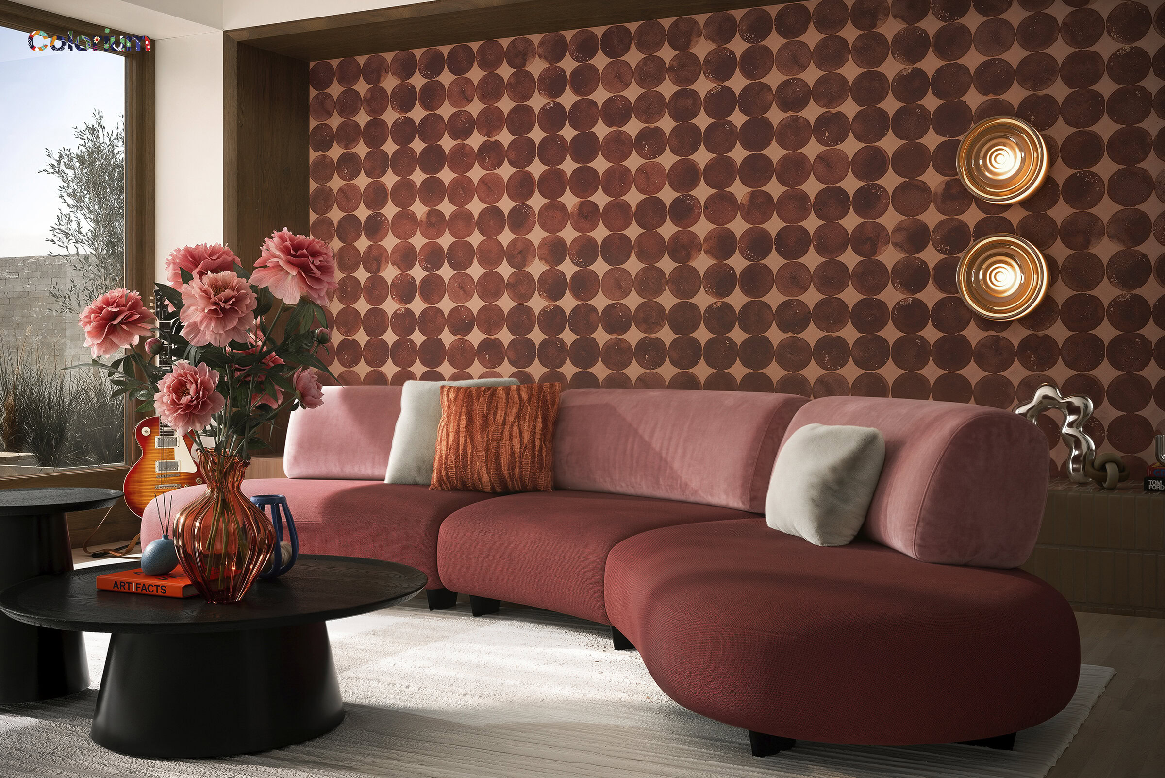 Elegant pink sectional sofa with plush cushions, set against a patterned accent wall, perfect for contemporary living rooms.