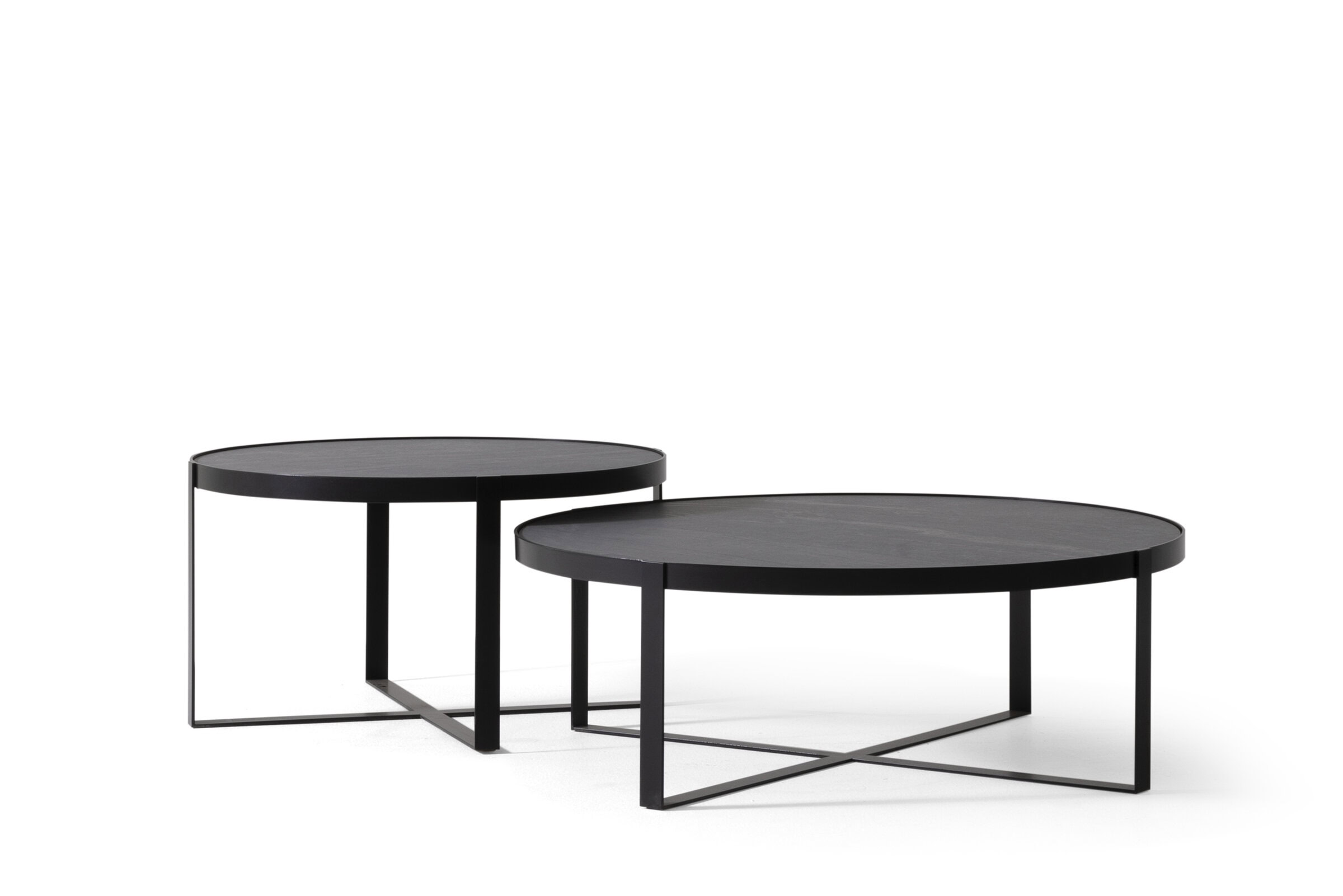 Sleek black modern nesting coffee tables with minimalist metal frames perfect for contemporary living room decor.
