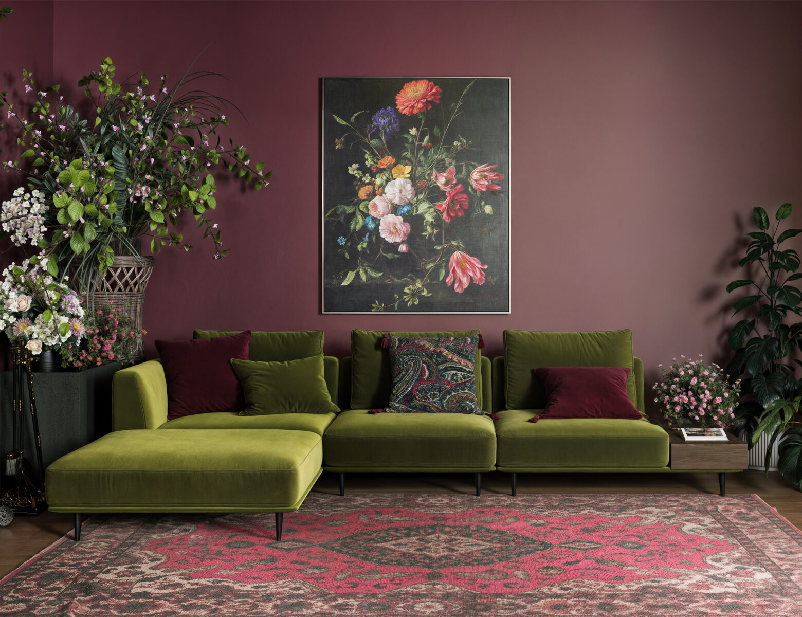 A stylish green velvet sectional sofa with plush cushions in a modern living room setting, complemented by floral artwork and vibrant decor.