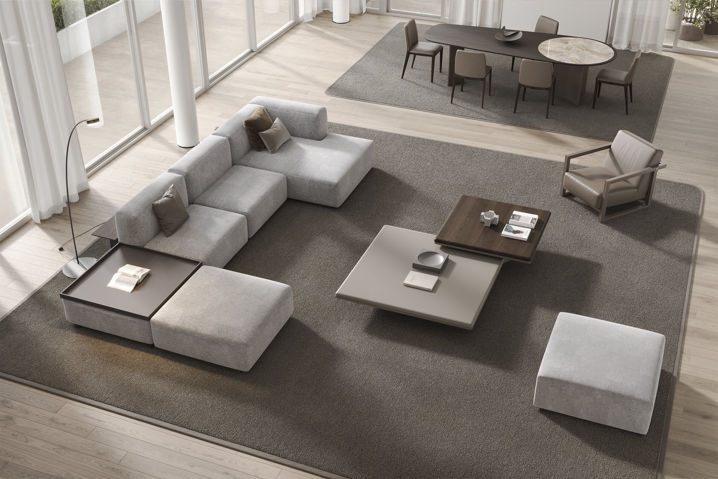 Elegant modern living room featuring a spacious L-shaped sofa, contemporary coffee tables, and a cozy armchair, perfect for stylish and comfortable home interiors.
