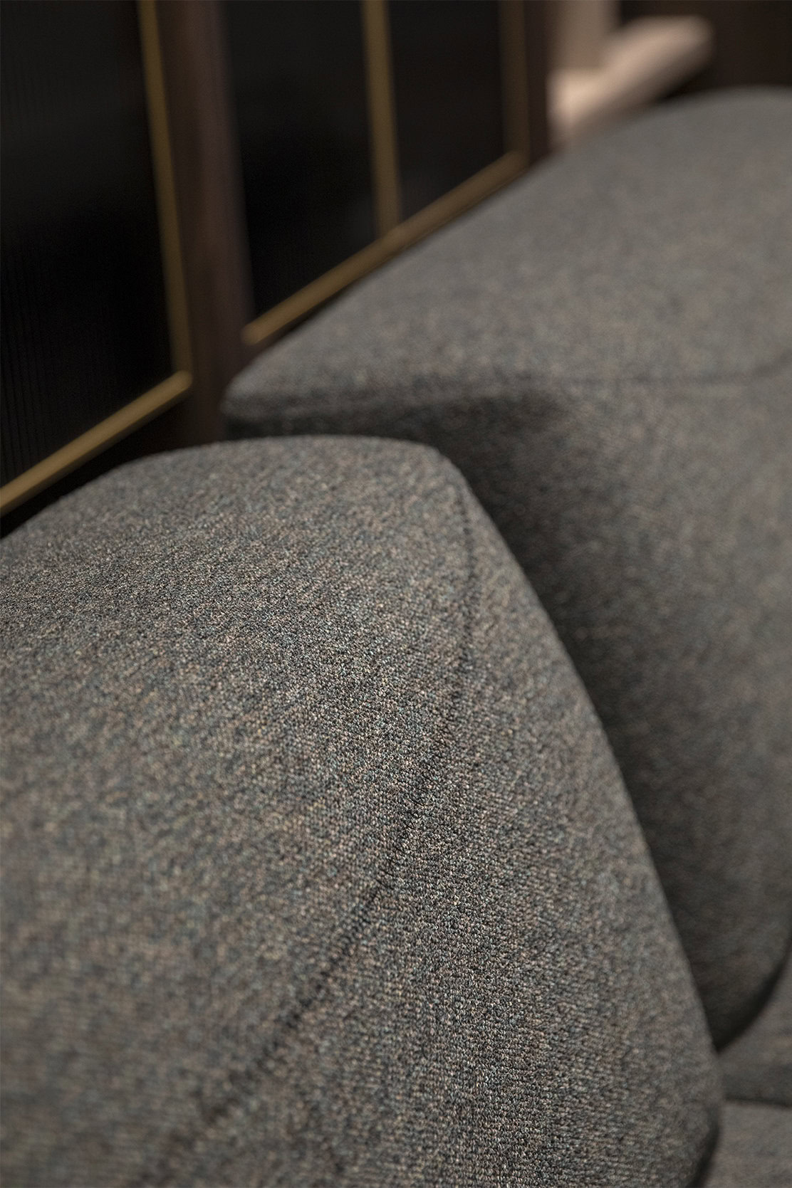 Soft textured fabric upholstery on a modern sofa, highlighting comfort and durability, ideal for contemporary living rooms and stylish furniture design at Saloni Furniture.