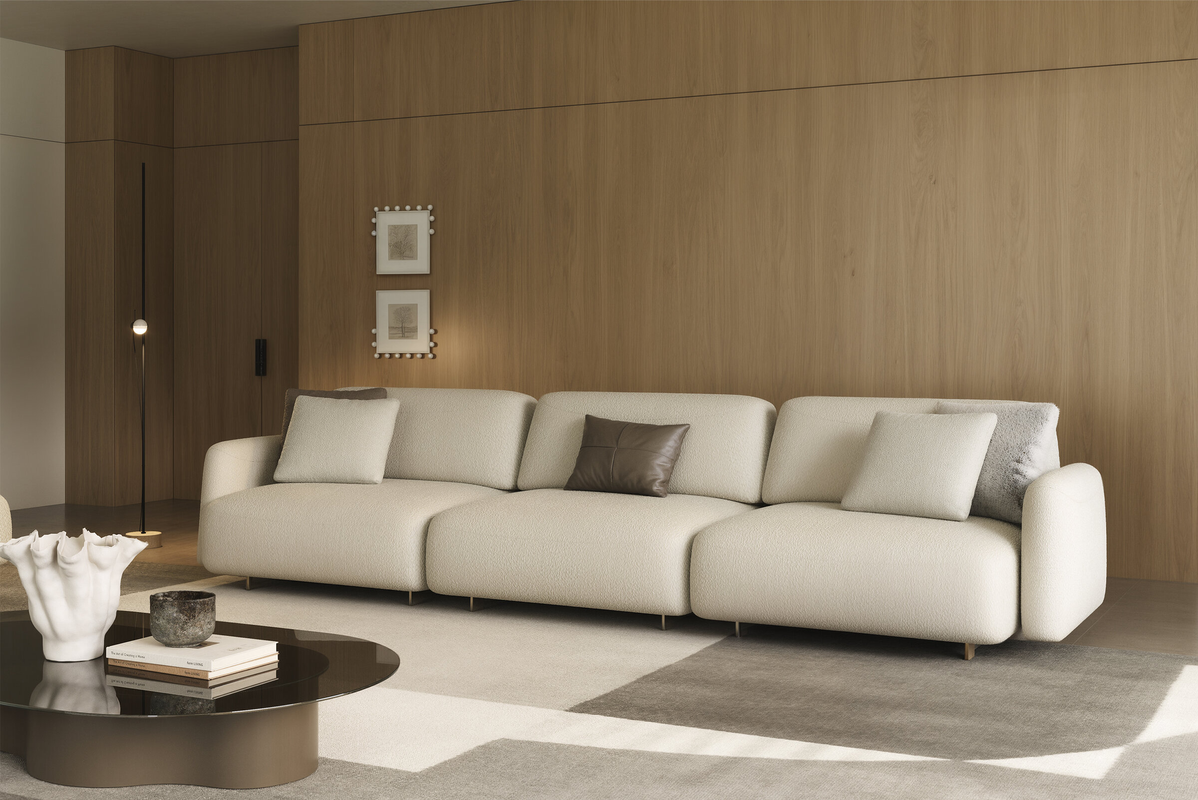 Luxurious beige fabric sectional sofa with modern design, accented with brown and gray throw pillows, ideal for stylish living rooms and seamless relaxation.