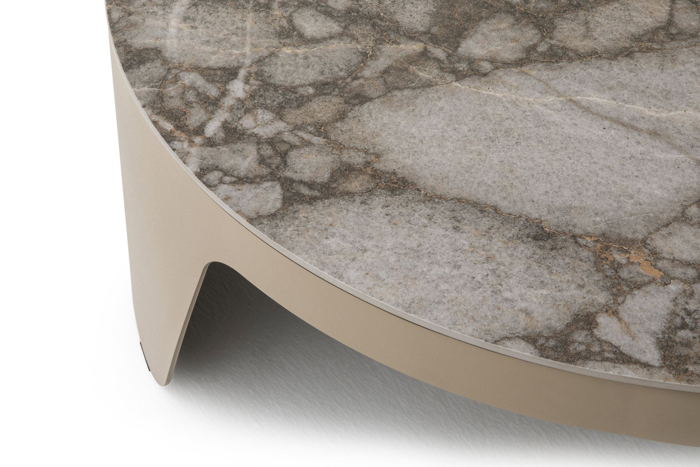 Polished marble top with beige curved metal base on modern Saloni Furniture coffee table in living room setting.