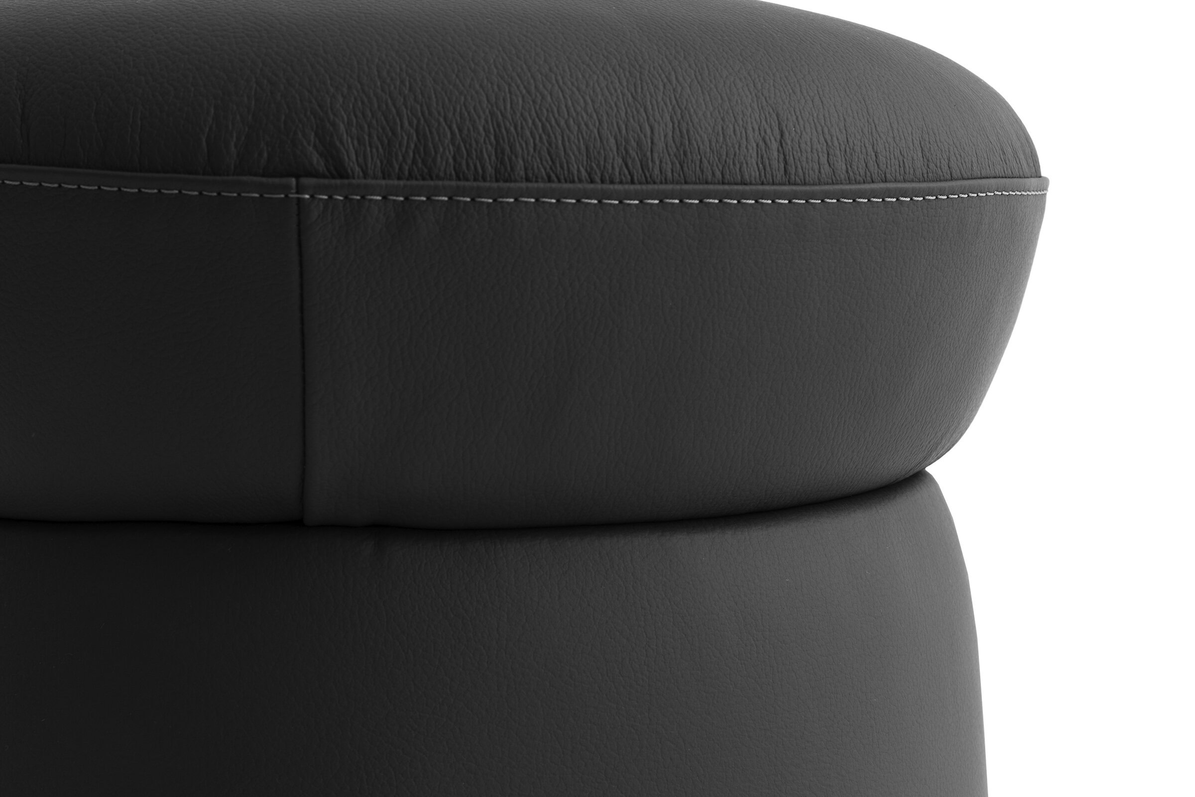 Luxurious black leather upholstery close-up showing detailed stitching and texture, perfect for modern furniture design, stylish for living room or office decor.