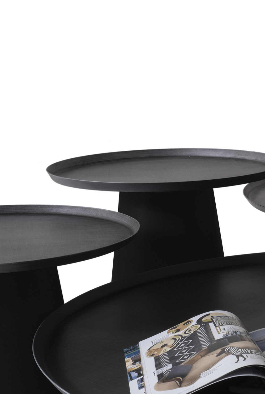 Black modern round coffee tables with sleek wooden surfaces and minimalist design, perfect for stylish living rooms and contemporary interior decor.