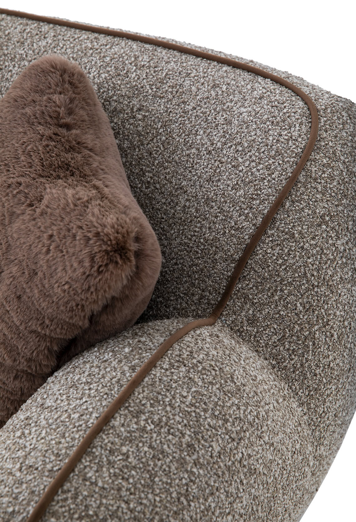 Luxurious textured fabric with a cozy brown faux fur pillow, emphasizing comfort and style for modern living spaces. Perfect for enhancing any room with sophisticated furniture design.