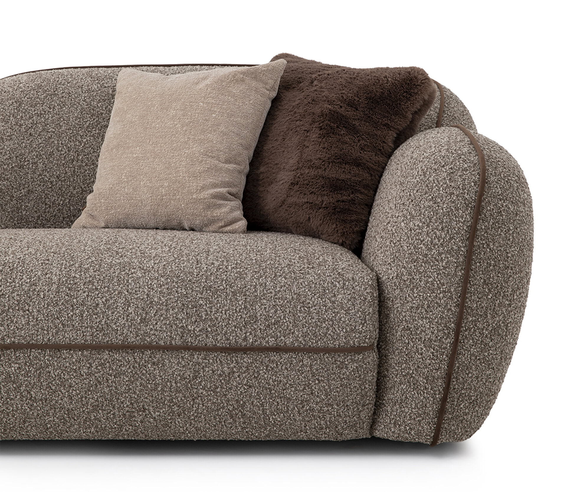 Comfortable beige fabric sofa with brown accent cushions and plush throw blanket, perfect for contemporary home decor and cozy living spaces.
