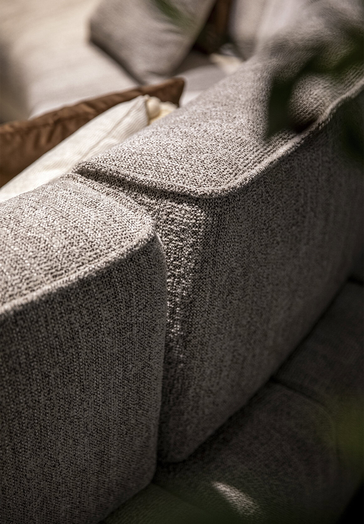 Luxurious fabric sofa with textured upholstery, modern design, and comfortable seating perfect for stylish interior living spaces.