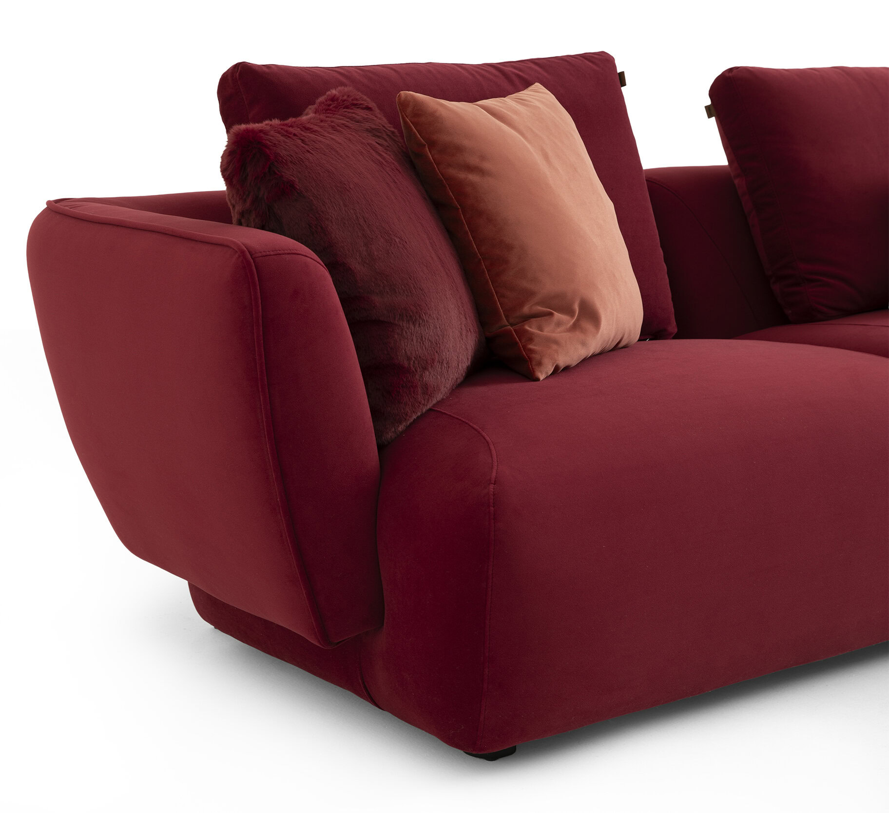 Luxurious red velvet sofa with plush cushions, perfect for modern living rooms and stylish home decor. Comfortable seating with high-quality upholstery and elegant design.