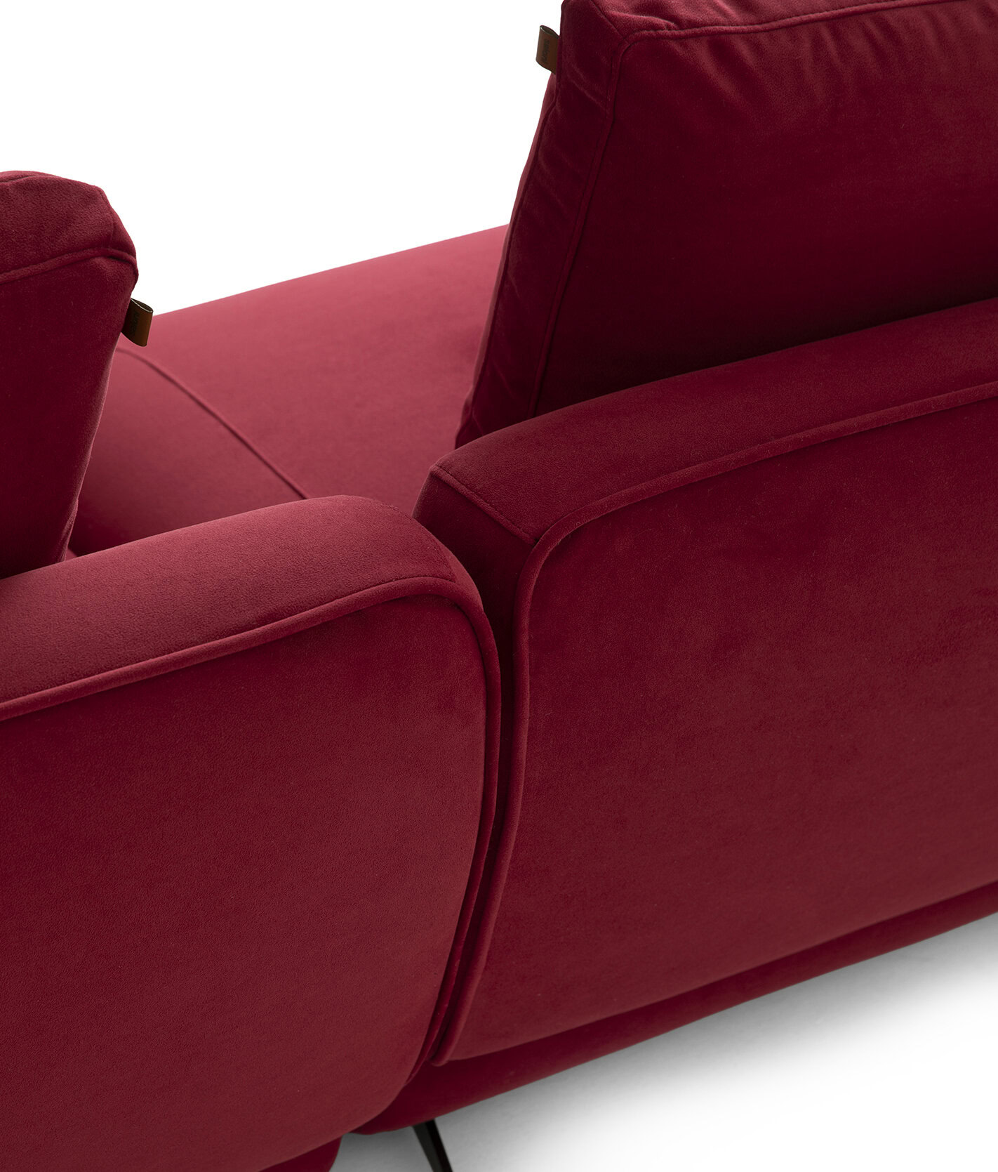 Elegant red velvet sofa with plush cushions, perfect for modern living rooms and stylish interiors. Crafted for comfort and durability, ideal for contemporary home decor.