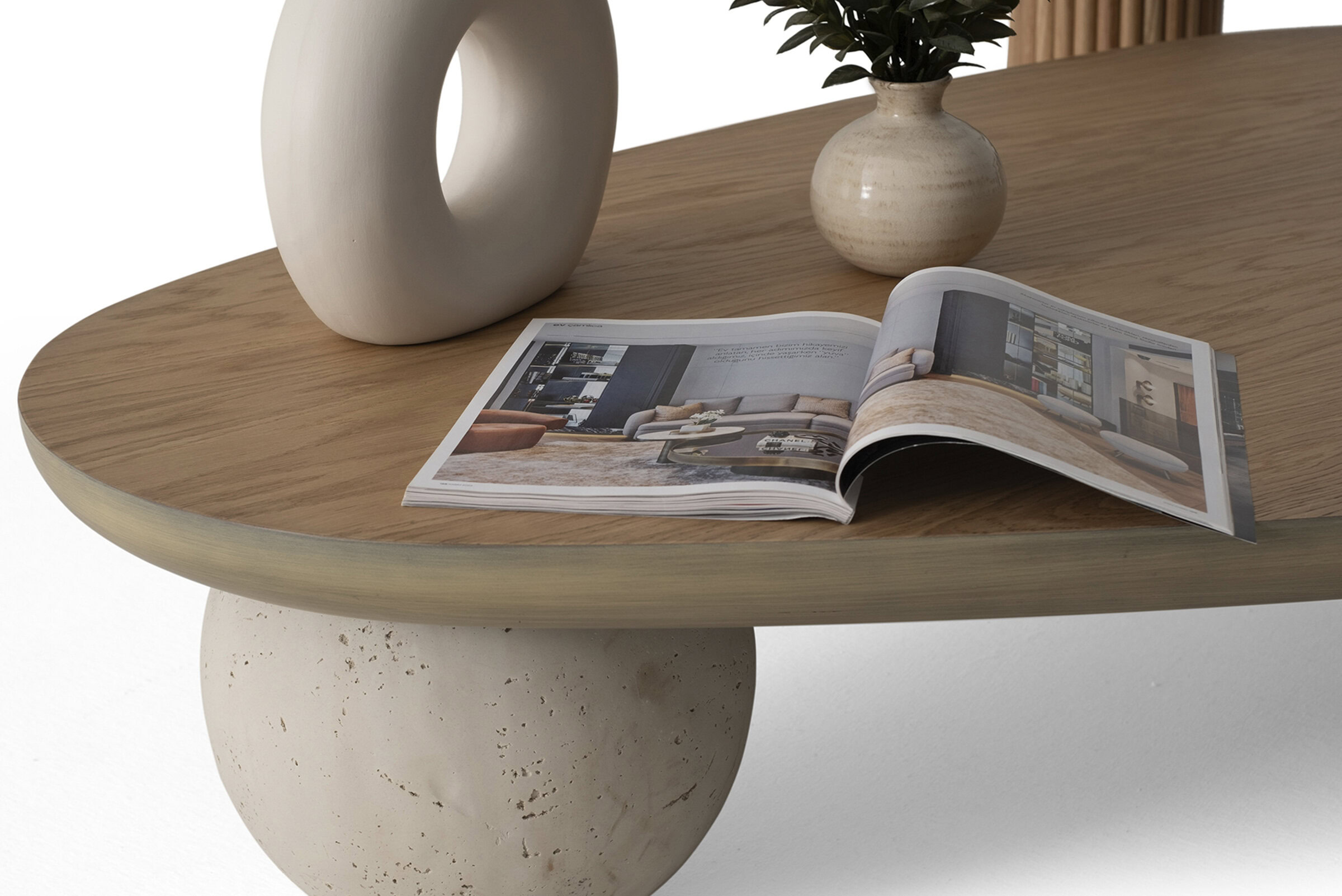 Elegant modern coffee table with a natural wood finish and unique base design, perfect for stylish living rooms and home decor.