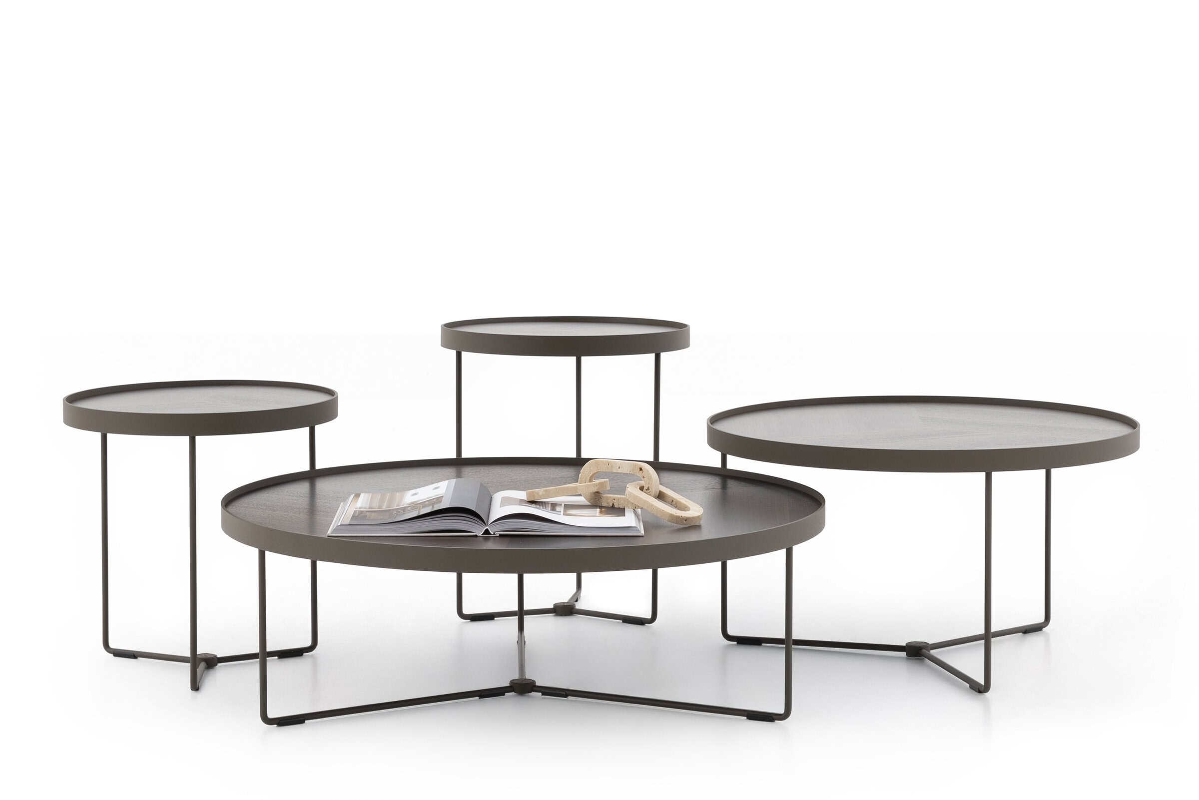 Contemporary multi-level coffee table set with round tabletops and minimalist metal frames, ideal for modern living room decor.