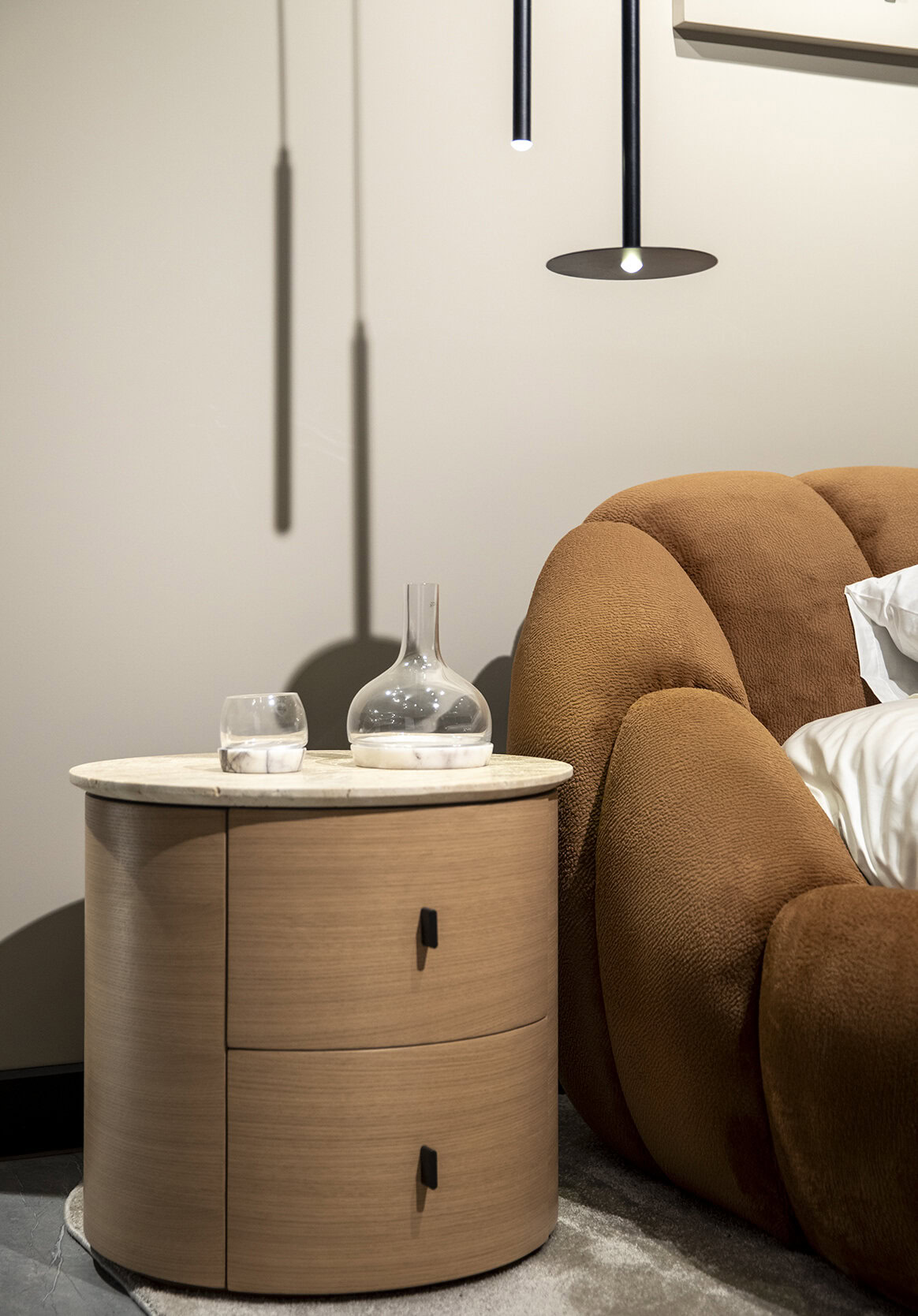 Sleek modern bedroom side table with curved wooden design and marble top, perfect for stylish bedroom decor.