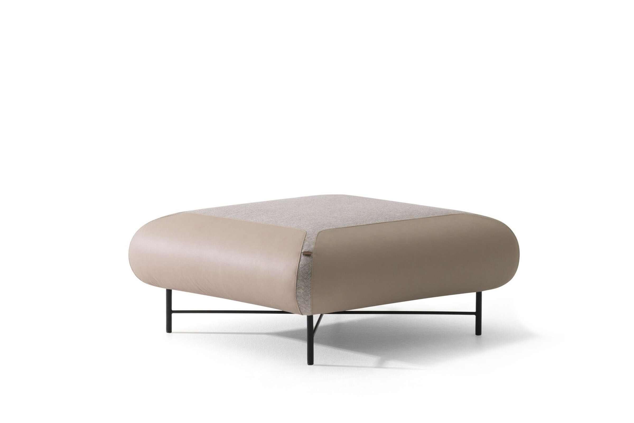 Luxurious modern beige and taupe plush fabric ottoman with sleek black metal legs, perfect for contemporary living room or bedroom decor. Stylish and versatile seating or footrest piece.