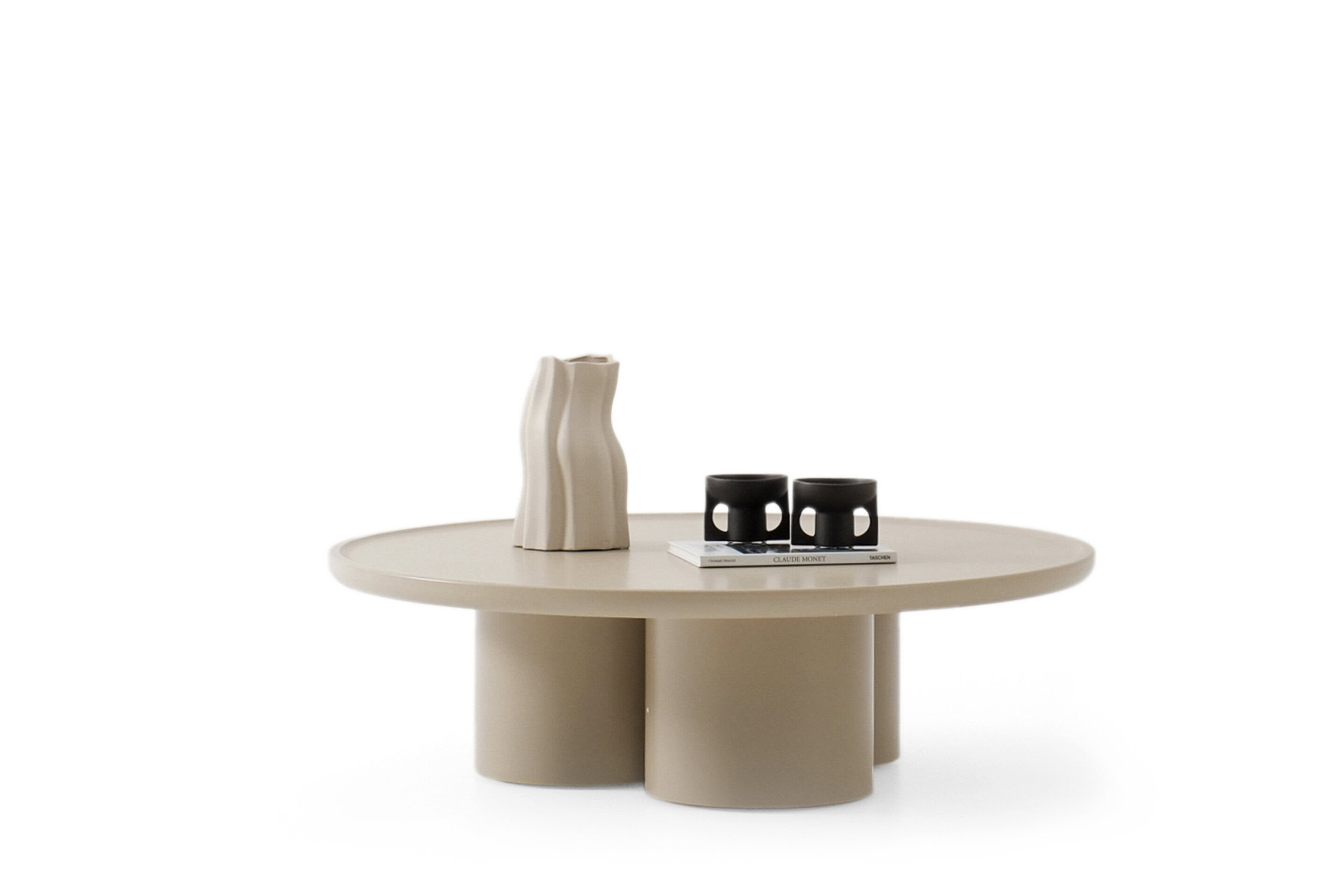 Elegant beige modern coffee table with sculptural accessories, ideal for contemporary living rooms, showcasing stylish furniture designs by Saloni Furniture.