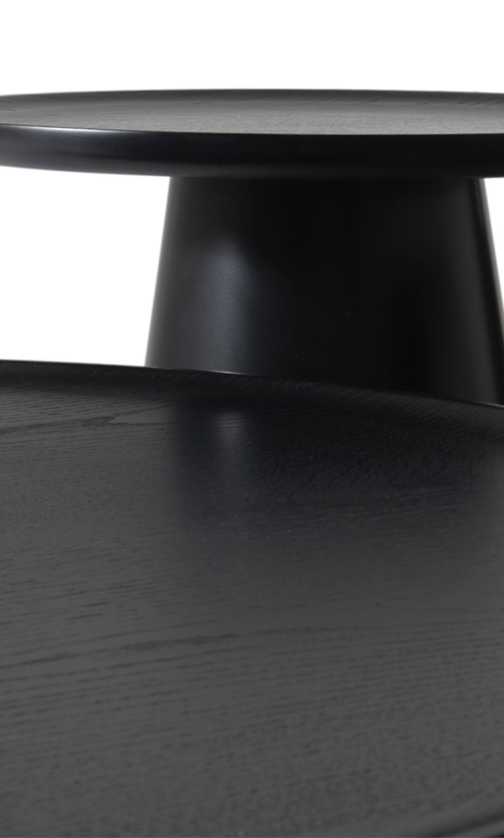 Stylish black wooden table with a smooth, matte finish, showcasing modern furniture design perfect for contemporary dining or living spaces.